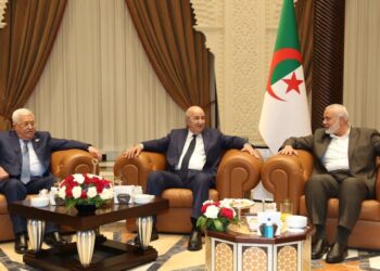 Palestinian rivals Abbas, Haniyeh shake hands in Algeria